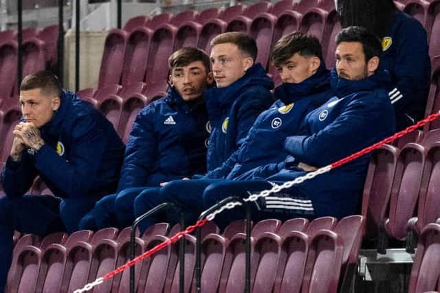 Ferguson (centre) has replaced his fellow international Aaron Hickey (right) as Bologna's Scotsman.  (Photo by Craig Foy / SNS Group)