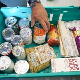 Food banks are now part of mainstream life in the UK, whether for those who use them or the people who donate (Picture: Matt Cardy/Getty Images)