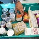 Food banks are now part of mainstream life in the UK, whether for those who use them or the people who donate (Picture: Matt Cardy/Getty Images)