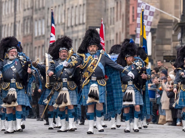 The RAF massed pipes and drums march down the Royal Mile for the Remembrance Sunday ceremony