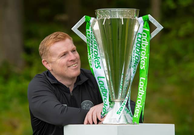 Celtic manager Neil Lennon celebrates the club being crowned champions for a ninth successive season.