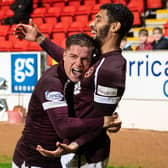 Josh Ginnelly is congratulated by Cammy Devlin after scoring for Hearts.