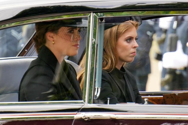 Princess Eugenie and Princess Beatrice are seen in a car following the State Funeral of Queen Elizabeth II at Westminster Abbey.