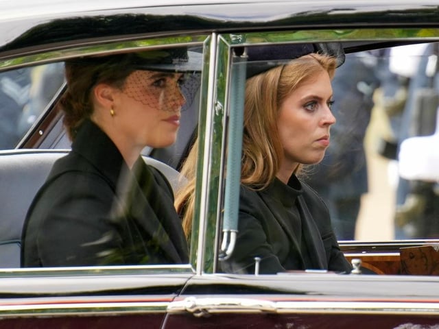 Princess Eugenie and Princess Beatrice are seen in a car following the State Funeral of Queen Elizabeth II at Westminster Abbey.