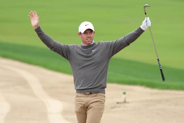 Rory McIlroy celebrates after holing out for an eagle-2 on the eight hole at Emirates Golf Club during the opening round of the Hero Dubai Desert Classic. Picture: Warren Little/Getty Images.