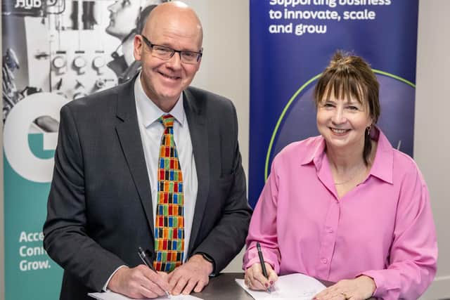 Neil Gordon, chief executive, GUH, and Suzanne Sosna, director for energy transition, Scottish Enterprise, signing the MoU at Subsea Expo International. Picture: Michal Wachucik/Abermedia