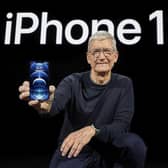 Apple CEO Tim Cook shows off the new iPhone 12.