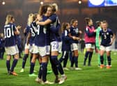 The Scotland team celebrate after the final whistle of the 2023 FIFA Women's World Cup play-off round 1 match between Scotland and Austria at Hampden Park. (Photo by Ian MacNicol/Getty Images)