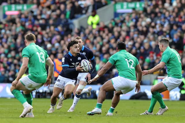 Sione Tuipulotu tries to break through the Irish defence.