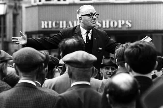 A crowd gathers around a speaker at the foot of The Mound. Picture: Robert Blomfield