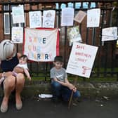 Maureen Cannell with her grandchildren outside Whiteinch Library in Glasgow. Picture: John Devlin