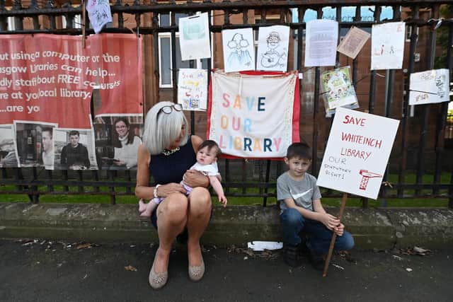 Maureen Cannell with her grandchildren outside Whiteinch Library in Glasgow. Picture: John Devlin