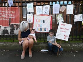 Maureen Cannell with her grandchildren outside Whiteinch Library in Glasgow. Picture: John Devlin