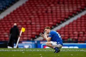 An emotional Liam Craig speaks to his family on his mobile phone following St Johnstone's Betfred Cup win over Livingston  (Photo by Craig Williamson / SNS Group)