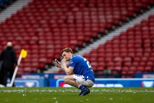 An emotional Liam Craig speaks to his family on his mobile phone following St Johnstone's Betfred Cup win over Livingston  (Photo by Craig Williamson / SNS Group)