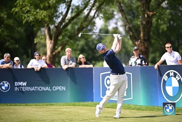 Connor Syme hits his 5-iron tee shot at the 220-yard second hole at Golfclub Munchen Eichenried. Picture: Stuart Franklin/Getty Images.