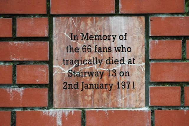 Tributes are paid outside Ibrox this morning in memory of those who lost their lives during the Ibrox Disaster in 1971. Picture: Ross MacDonald/SNS Group