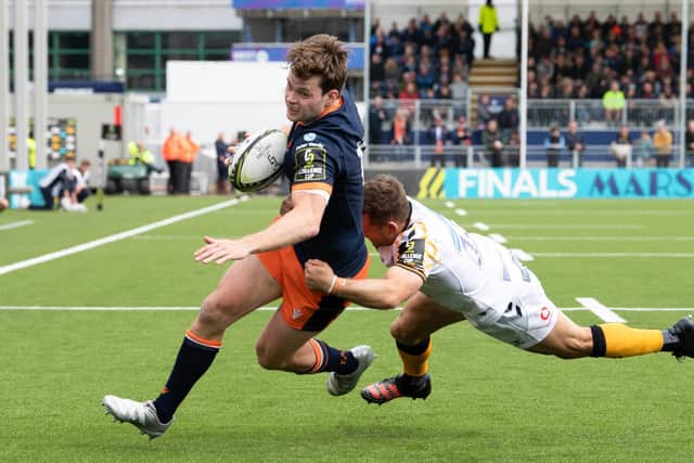 Chris Dean attempts to elude the tackle of Wasps' Jimmy Gopperth during Edinburgh's recent Challenge Cup quarter-final. (Photo by Ross Parker / SNS Group)