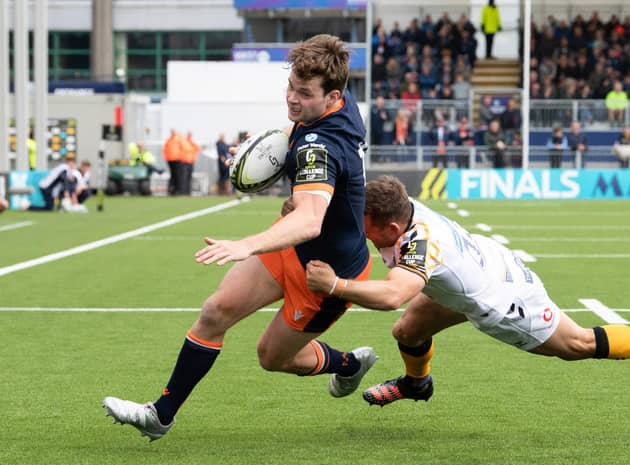 Chris Dean attempts to elude the tackle of Wasps' Jimmy Gopperth during Edinburgh's recent Challenge Cup quarter-final. (Photo by Ross Parker / SNS Group)