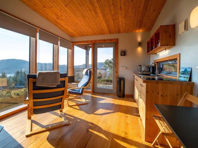 Batbox has a bright living area with comfortable chairs to enjoy the view.