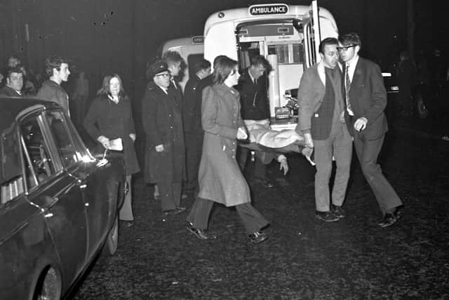 Ibrox disaster - injured fans are stretchered into ambulances outside Ibrox stadium, home of Rangers FC, after the collapse of stairway 13 on January 2, 1971