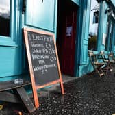 A pub sign in Glasgow put up during the Covid pandemic. Picture: John Devlin