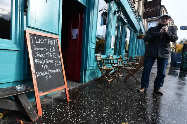 A pub sign in Glasgow put up during the Covid pandemic. Picture: John Devlin