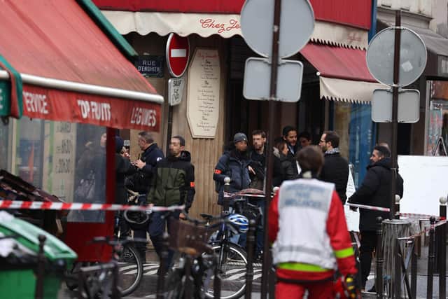 French police secure the street after several shots were fired along rue d'Enghien in the 10th arrondissement, in Paris on December 23, 2022. - Two people were killed and several injured in a shooting in central Paris on December 23, 2022, police and prosecutors said, adding that the shooter, in his 60s, had been arrested. (Photo by Thomas SAMSON / AFP) (Photo by THOMAS SAMSON/AFP via Getty Images)