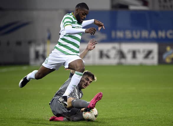 Celtic's Olivier Ntcham is challenged by Riga's Marko Djurisic during Celtic's Europa League third qualifying round win  in the Skonto stadium. (AP Photo/Roman Koksarov)