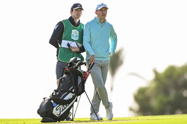 Euan Walker talks through a shot on the first hole with caddie Steven Devlin at Club de Golf Alcanada. Picture: Octavio Passos/Getty Images.
