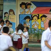Filipino children often work long hours to complete homework tasks.