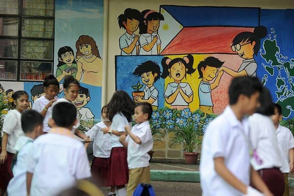 Filipino children often work long hours to complete homework tasks.