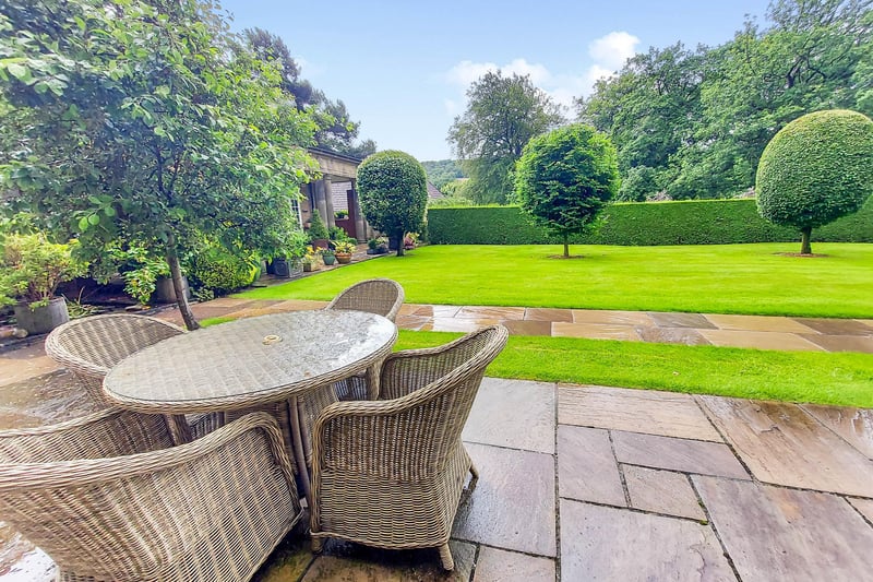 The property is in extensive communal gardens, with access to a gym and a tennis court.