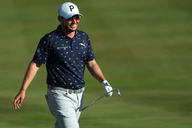 Ewen Ferguson of Scotland celebrates as he chips for an eagle on the 18th hole. Photo by Andrew Redington/Getty Images.