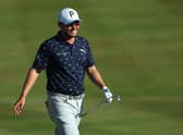 Ewen Ferguson of Scotland celebrates as he chips for an eagle on the 18th hole. Photo by Andrew Redington/Getty Images.