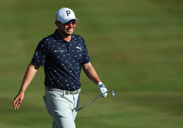 Ewen Ferguson of Scotland celebrates as he chips for an eagle on the 18th hole. Photo by Andrew Redington/Getty Images.