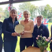Mortonhall's winning team in the Edinburgh Ladies Inter Club tournament received the trophy from host club Liberton's lady captain Sue Hay.