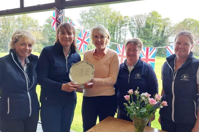 Mortonhall's winning team in the Edinburgh Ladies Inter Club tournament received the trophy from host club Liberton's lady captain Sue Hay.