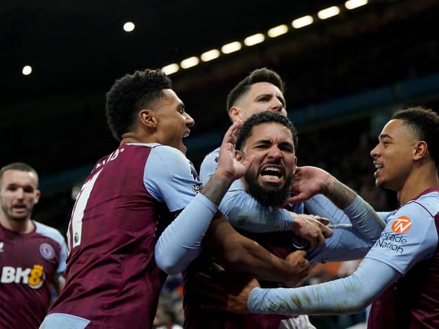 Aston Villa's Douglas Luiz (centre) celebrates after scoring his side's winner against Burnley.