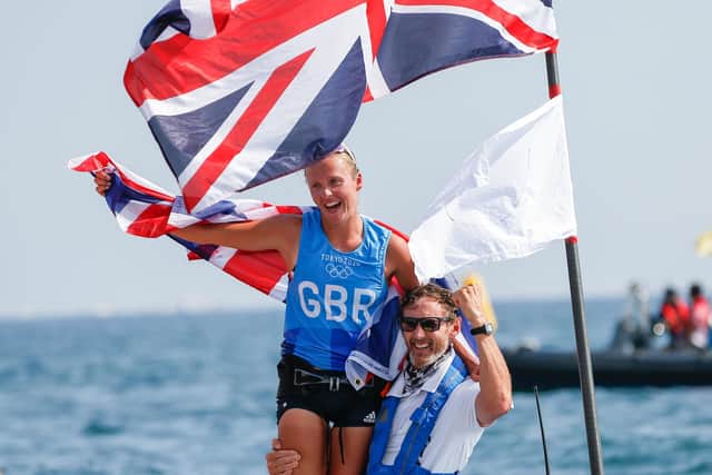 Great Britain's Emma Wilson celebrates after finishing in third place to take the bronze medal in the Women's Windsurfer - RS:X Medal Race at Enoshima (Photo credit: Thomas Bakker/PA Wire via DPA)