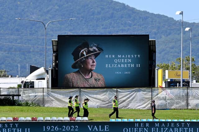 A portrait of the late Queen Elizabeth II is displayed at the Cazalys Stadium in Cairns, New Zealand, ahead of an international cricket match against Australia (Picture: Saeed Khan/AFP via Getty Images)