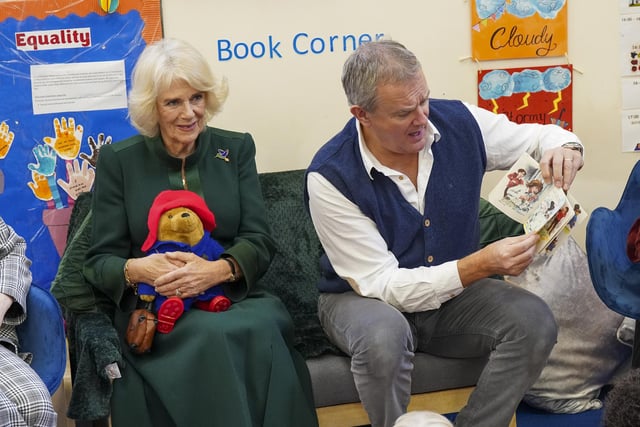 The Queen Consort with actor Hugh Bonneville during a special teddy bears picnic at a Barnardo's Nursery in Bow, London