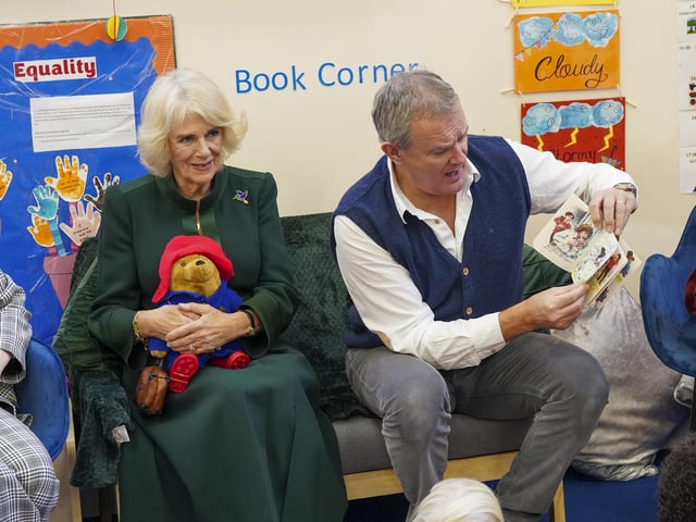The Queen Consort with actor Hugh Bonneville during a special teddy bears picnic at a Barnardo's Nursery in Bow, London
