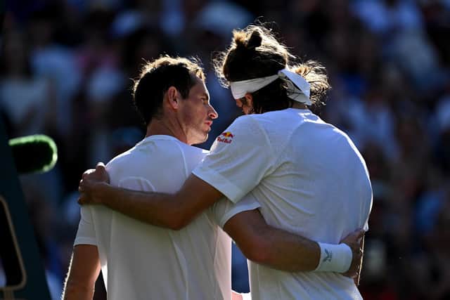 Andy Murray and Stefanos Tsitsipas embrace after their second round match at Wimbledon. (Photo by Shaun Botterill/Getty Images)
