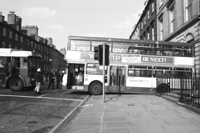 An Eastern Scottish bus rolled backwards, crashing through the railings of a York Place flat in Edinburgh, May 1988   Pic: George Smith