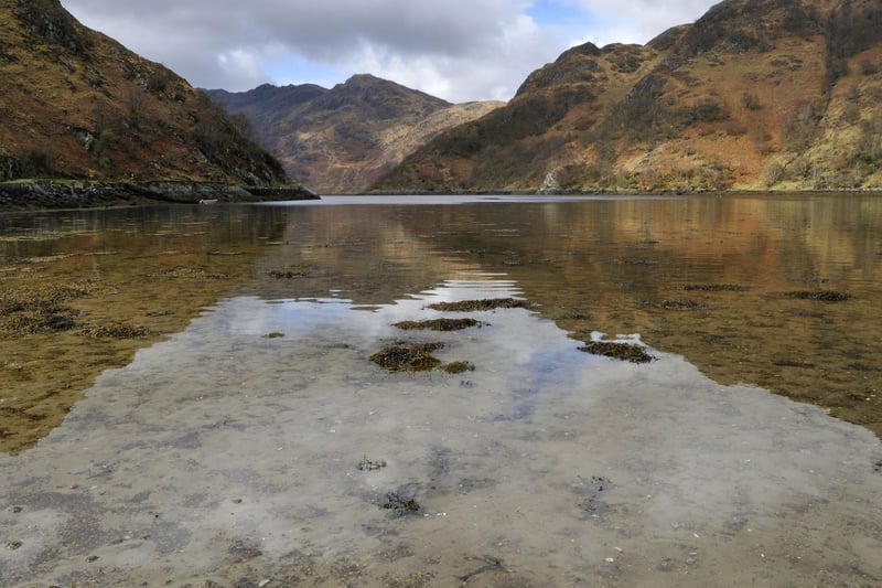 It's a challenge just getting to Ladhar Bheinn as it sits in the middle of the Knoydart peninsula, which isn't reachable by road. Access it via the path along Loch Hourn (pictured) or catch a boat from Mallaig and overnight on the peninsula.