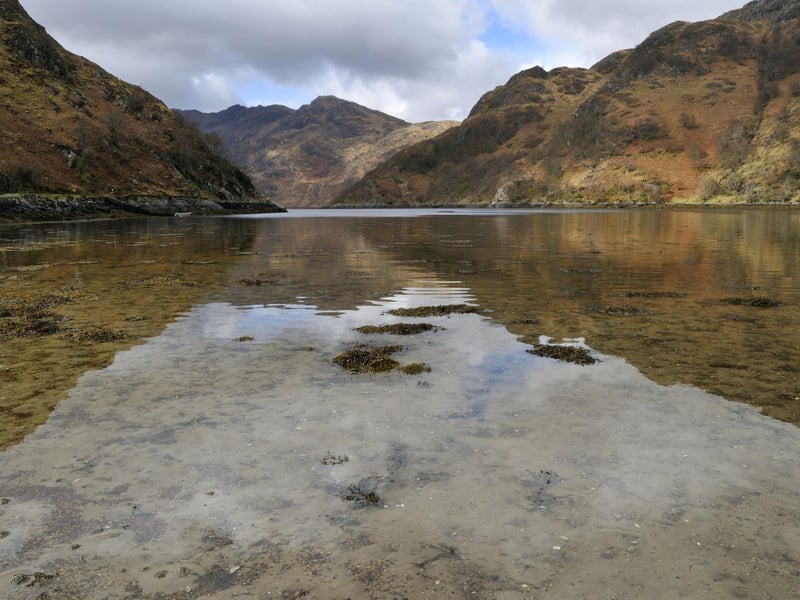 It's a challenge just getting to Ladhar Bheinn as it sits in the middle of the Knoydart peninsula, which isn't reachable by road. Access it via the path along Loch Hourn (pictured) or catch a boat from Mallaig and overnight on the peninsula.