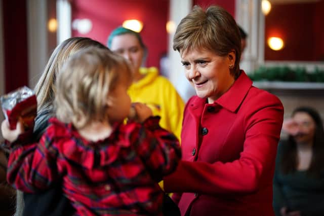 First Minister Nicola Sturgeon meets children as she joins care experienced young people for a performance of An Edinburgh Christmas Carol at the Lyceum Theatre, Edinburgh. Picture: Peter Summers/PA Wire