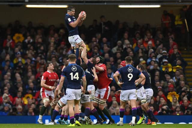 Sam Skinner wins lineout ball against Wales in Cardiff. (Photo by Paul Ellis/AFP via Getty Images)