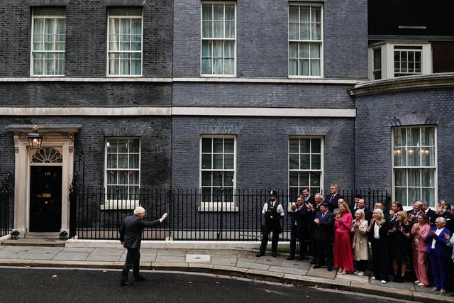 Outgoing Prime Minister Boris Johnson makes a speech outside 10 Downing Street, London, before leaving for Balmoral for an audience with Queen Elizabeth II to formally resign as Prime Minister. Here he waves to those gathered outside.